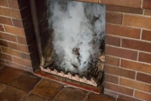 If you notice smoke coming from your chimney, it's a good idea to call a professional for an inspection to identify the cause.